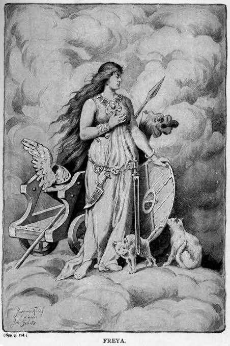 19th-century illustration of Freya standing with a spear and shield, flanked by cats.